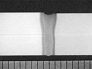 Fig.5. Cross section of autogenous CO2 laser weld in 8.0mm C-Mn steel plate produced with 4.0kW laser power and 1.2m/min travel speed, 0.2mm joint gap (mm scale shown).