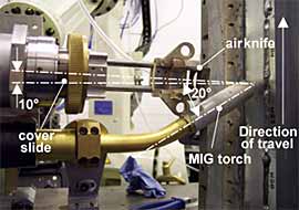 Fig.1. The process set-up used for the welding trials in the vertical-up (PF) welding position