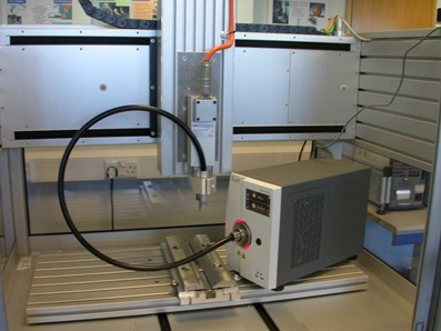 Figure 5: Large bed µFSW machine at TWI with supplementary radiant heating delivered by fibre to the µFSW head