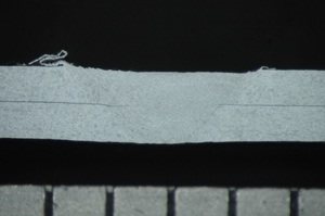 Figure 8: Lap weld between two 300μm thick sheets of aluminium alloy - Cross section of weld