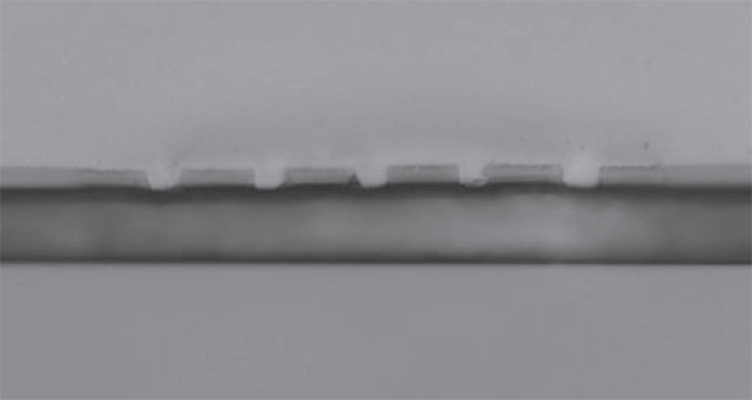 Fig. 8 Welded sample in cross section with 5 μm wide channels prepared using diode laser transmission welding.