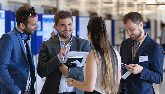 Dimitrios Fakis (centre left) speaking to other students at the NSIRC 2019 Annual Conference. Photograph: TWI Ltd / NSIRC