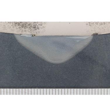 Figure 1. Section through an 8mm deep friction stir weld made into a 28mm wall thickness, API-X65 steel pipe. The weld was performed under oil and is defect free