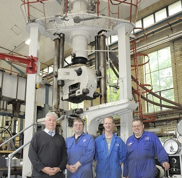 L to R: Stuart Green (Lab Manager) Alan Parker (Team Leader), Dan Bloom (Technician), and Martin Frost (Technician) stand in front of the Lösenhausen machine on the last day of operation for the fatigue laboratory.