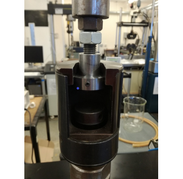 Figure 2. Photograph of specimen in a tensile testing machine