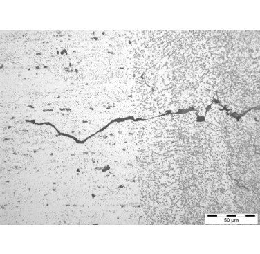 Figure 6. Crack in EB welded aluminium alloy 6061 (weld metal, right; parent material, left)