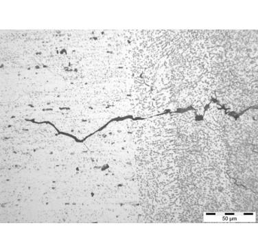 Figure 6. Crack in EB welded aluminium alloy 6061 (weld metal, right; parent material, left)