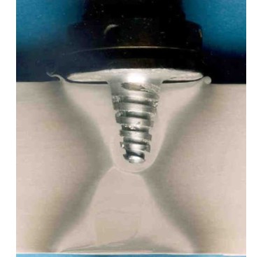 Figure 14. WhorlTM FSW tool in front of a section taken from weld in 75mm thick AA 6082-T6