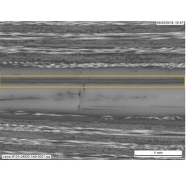 Figure 1. Sacrificial PEEK interlayer between two carbon/PEEK laminates. Yellow lines denote weld location