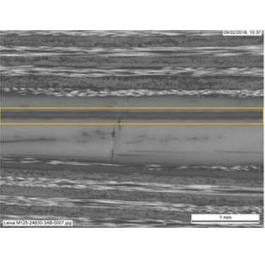 Figure 1. Sacrificial PEEK interlayer between two carbon/PEEK laminates. Yellow lines denote weld location