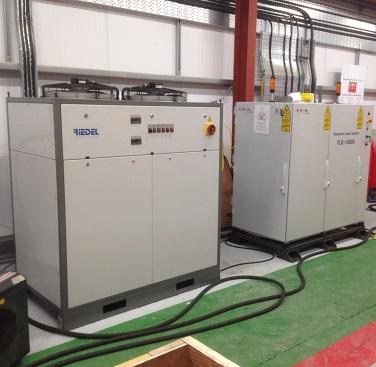 Installation of the laser (right) and its chiller (left) on site - after a 500 miles plus road trip.