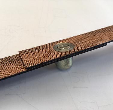 Through thickness electrically conductive reinforcements