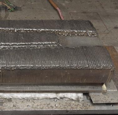 Close-up of the test block with weld layers applied