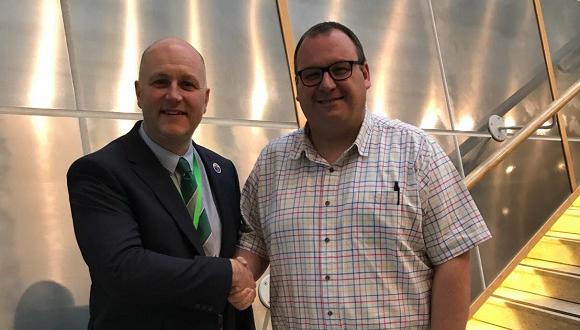 Nick Marshall (Left) handing over the Chairmanship of the AWFTE to Kevin Dunn (Right)