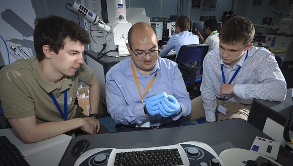 The two scholars at work with Kostas Georgilas (centre).
