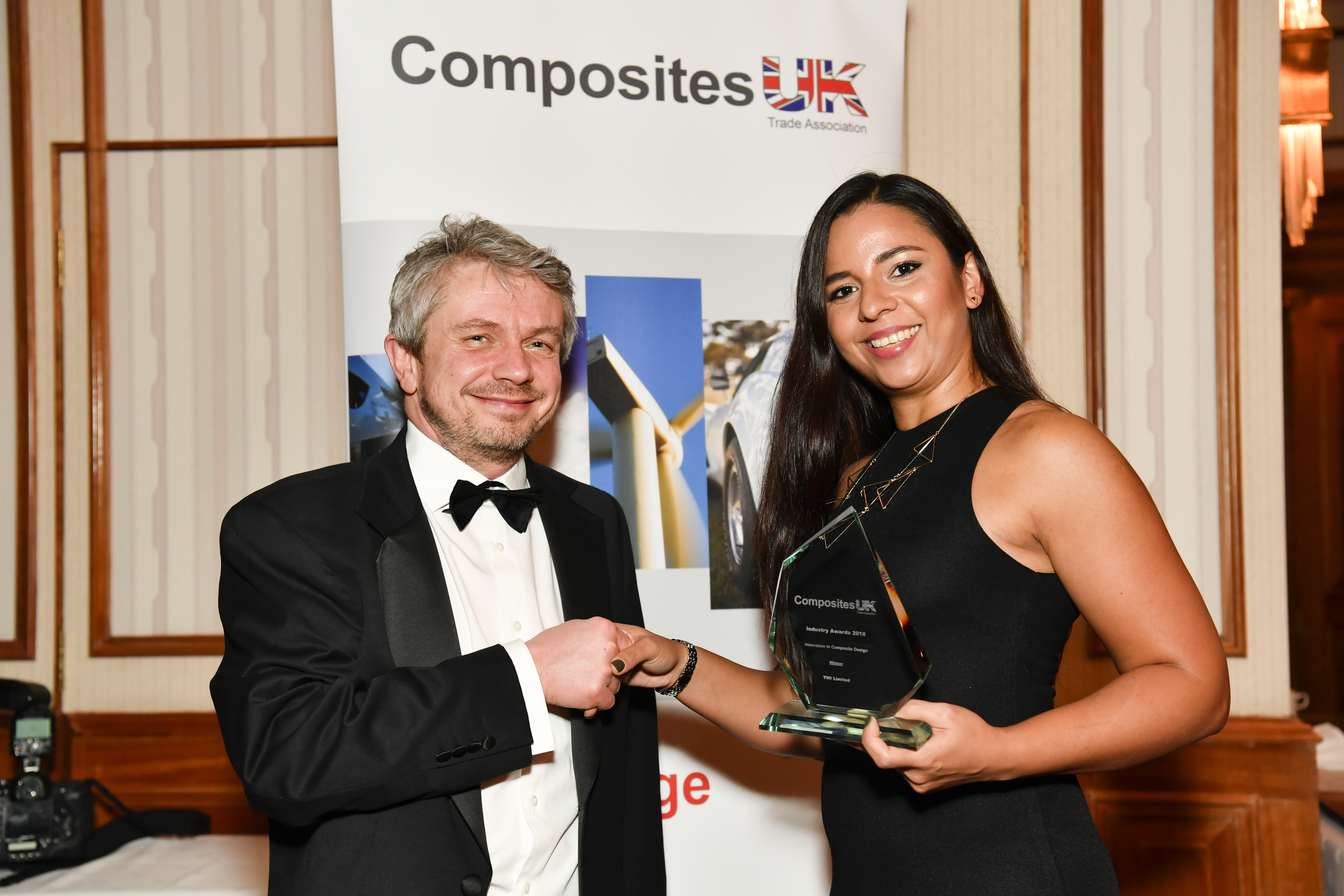 Jeremy Whittingham, part of the organisational team for the Advanced Engineering Show (left), presents Jasmin Stein with the award
