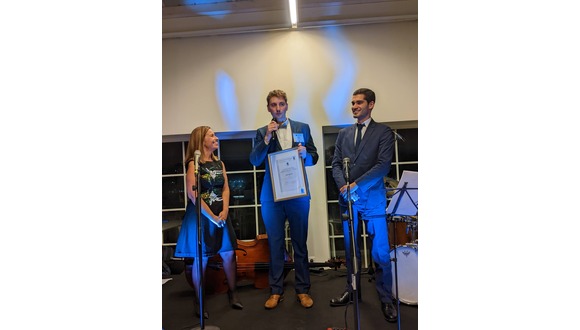 Josh Barras (centre) receives his certificate