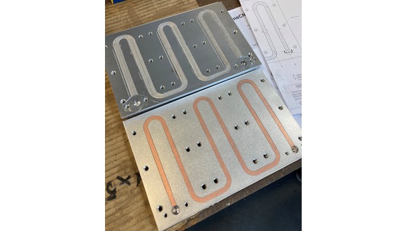 CoreFlow prototype (top) and plate produced using traditional methods (below) for a comparative study