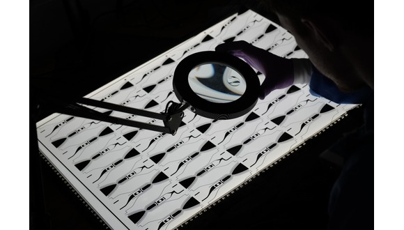 Figure 1. High batch size thruster photomask being inspected