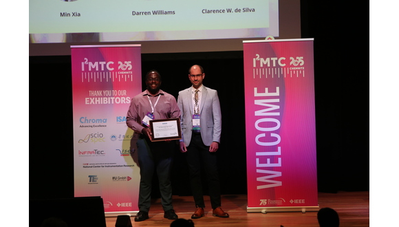 Figure 1. TWI’s Darren Williams and Roberto Ferrero (University of Liverpool) receive the award