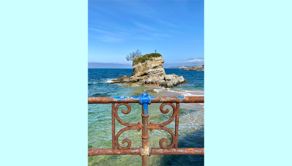 "The statue of child Neptune, taming the sea, but not its consequences on metal. Work of sculptor Ramón Muriedas in Playa del Camello in Santander, Cantabria, Spain." Photo: Adamantini Loukodimou.