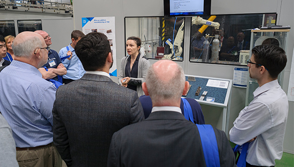 TWI's Claire Verdon speaks to delegates during the tour of TWI's laboratories