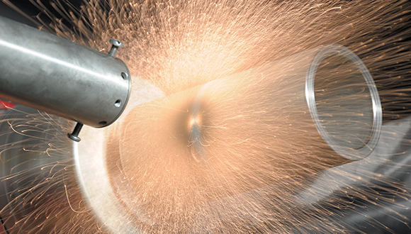 Cold Spray powder particles are accelerated to high velocities by a supersonic compressed gas jet at temperatures far below their melting point. Photo: TWI Ltd