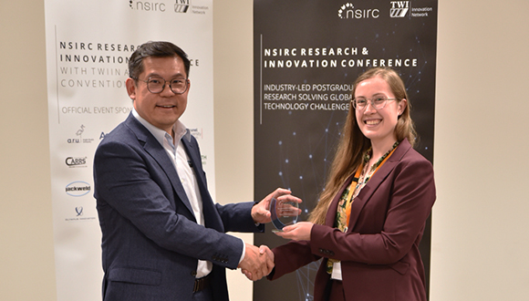 Tat-Hean Gan (left), TWI Director of Membership, Innovation and Global Operations, presents Alice Appleby with her award. Photo: TWI Ltd