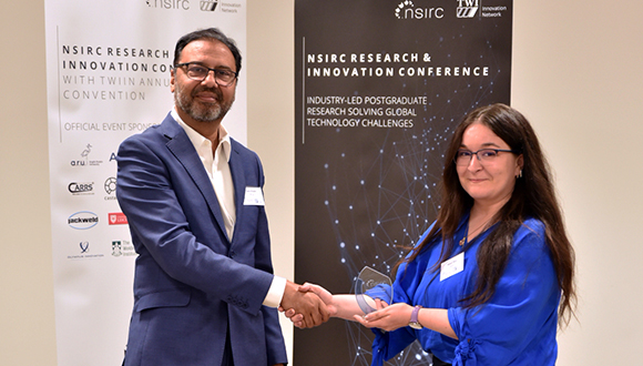 Aamir Khalid (left), TWI CEO, presents Magali Rego (right) with her award. Photo: TWI Ltd