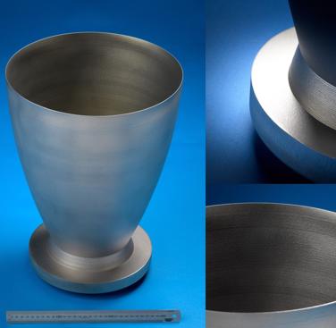 Figure 2: Inconel 718 rocket nozzle, standing 420 mm tall with a wall thickness of 1.3mm. Photographed in the as-built condition (the part was subjected to a light bead blasting to remove excess powder).