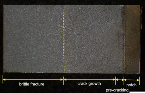 Figure 4 Example of fracture surface of a FCG test specimen, showing the final crack front before brittle fracture