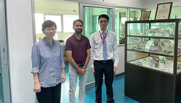 From left, Associate Professor Siriporn Daopiset, Muhammad Tahir Farooq and Assistant Professor Dr Peerawatt Nunthavarawong, outside the Corrosion Inhibitor Testing Laboratory. Photo: KMUTNB / TGGS