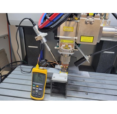 Figure 2. Applying a contactless vibration to the molten pool area during the welding.