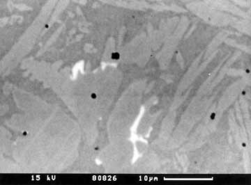b) backscattered electron image of intermetallic phase