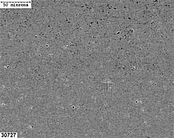 b) high microhardness alumina coatings (03-95) showing coatings with low microhardness exhibit greater amounts of porosity within the coating.