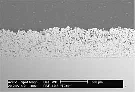 Fig.3a) BSE image of CTi sprayed onto ground Ti6Al4V at 29bar. Thickness ~530 µm