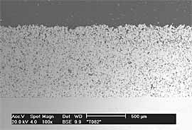  Fig.3b) BSE image of FTi sprayed onto ground Ti6Al4V at 29bar. Thickness ~990 µm.