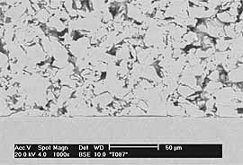 Fig.4b) BSE image of FTi sprayed onto ground Ti6Al4V at 15 bar