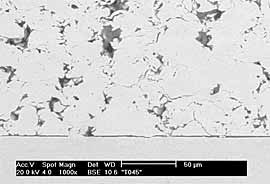 Fig.5b) BSE image of CTi sprayed onto ground Ti6Al4V at 29 bar