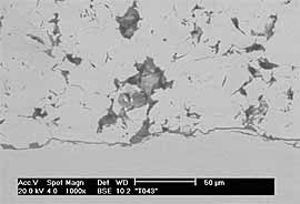 Fig.5c) BSE image of CTi sprayed onto grit-blasted Ti6Al4Vat 29bar