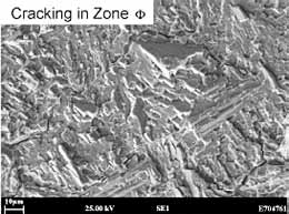 Fig.4. SEM micrographs showing the two types of fracture morphology in the initiating stages of cracking a) mid-bead position