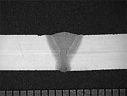 Fig. 4. Transverse cross-section of a weld made in 5mm thickness S355J2G3 at a laser power of 5kW, a laser focus position of -5mm and a travel speed of 2m/min. Scale bar in millimetres