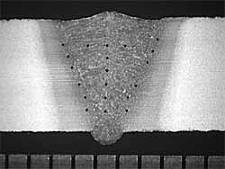 Fig. 5. Transverse cross-section of a weld (with hardness indentations) made in 5mm thickness DH36 at a laser power of 3.5kW, a laser focus position of -5mm and a travel speed of 0.9m/min. Scale bar in millimetres.