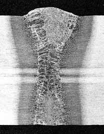 Fig. 4: Transverse cross-section of melt run in 15mm thick C-Mn steel. (Laser power 9kW, travel speed 0.30m/min, focus at surface)