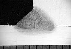 Fig.9. Transverse cross-section of optimised laser hybrid weld showing small, mitre-shaped external fillet and wide laser root. Scale in millimetres