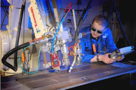 Figure 1. A laser vision sensor mounted ahead of a hybrid welding process