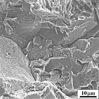 Fig.15b) Magnification of the initiation area showing the change from intergranular failure to transgranular cleavage 