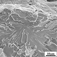 Fig.17a) Scanning electron micrograph of the cleavage initiation area in front of the fatigue crack-tip of specimen no. 9, representative of the toughest CTOD specimens (Group 2), characterised by large local plastic strain and microductility 