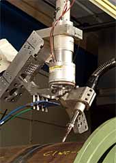 Fig.3. Laboratory demonstration of hybrid Nd:YAG laser/MAG welding for pipelines