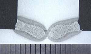 Fig.3. Cross section of double-sided T butt joint at non-optimised conditions, therefore showing only partial penetration. Scale in millimetres